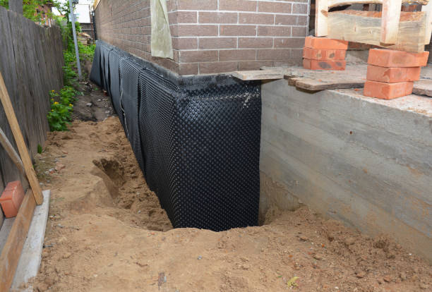 SJ Waterproofing Pros technician performing targeted Interior Drainage System assessment in Apison, TN
